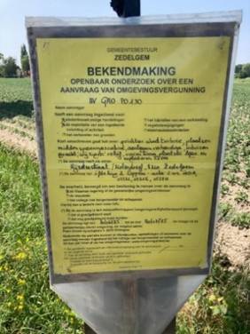 A sign in a field

AI-generated content may be incorrect.